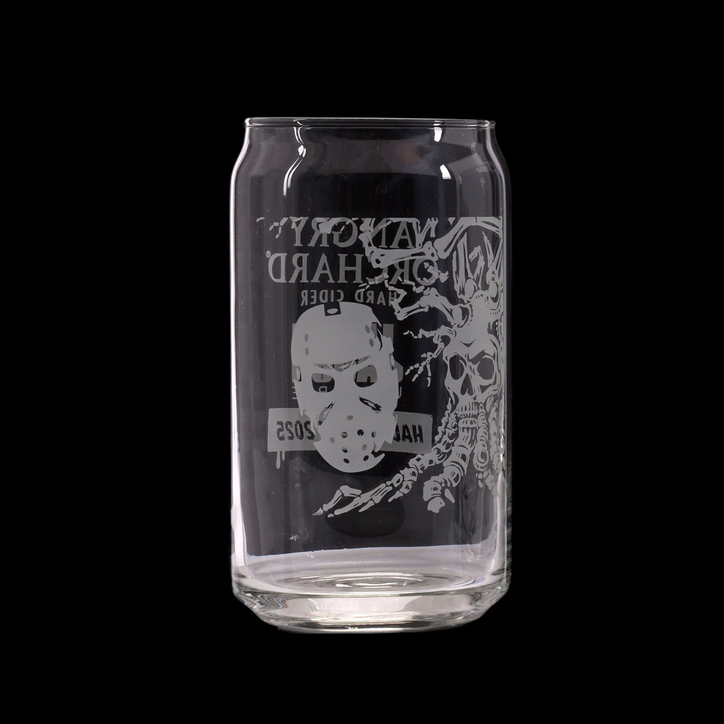 Clear glass can with black label featuring a white mask and skeleton design on a white background