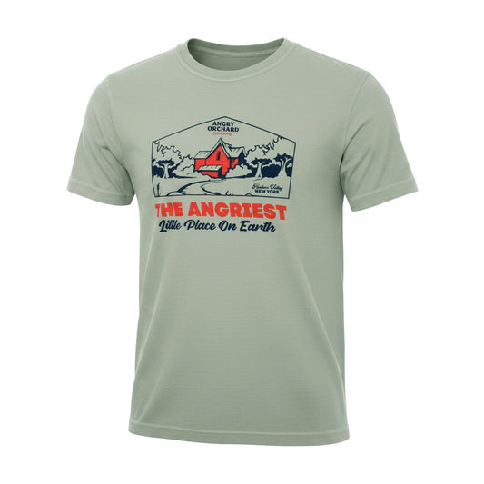 A sage green crewneck t-shirt featuring a vintage-style graphic print on the front with a mountain scene, a red tent, and the text 'THE ANGRIEST Little Place On Earth' in red and navy blue.