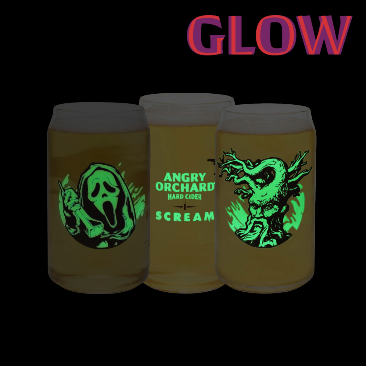 Three glow-in-the-dark beer cans on a black background under the word 'GLOW' in pink-purple text. The cans show green graphic designs: a Ghostface silhouette on the left, 'ANGRY ORCHARD HARD CIDER SCREAM' in the center, and a monster on the right.