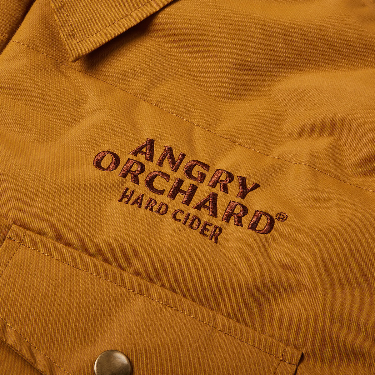 Brown button up jacket on white background text on left chest says 'angry orchard hard cider'