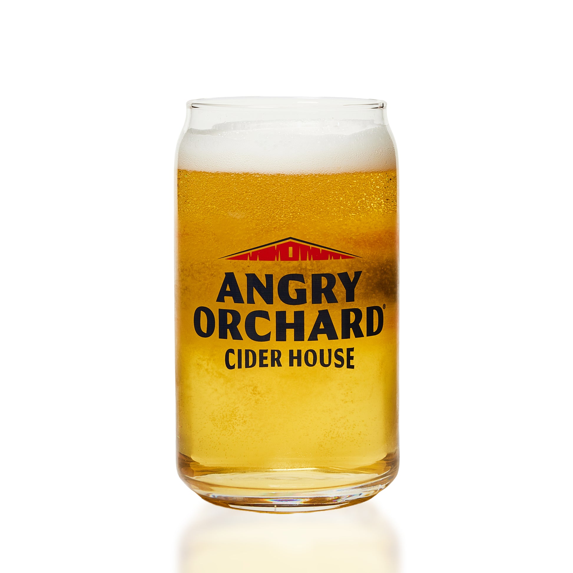 A clear glass can-shaped glass filled with golden cider and topped with white foam, featuring the Angry Orchard Cider House logo on the front, set against a clean white background.