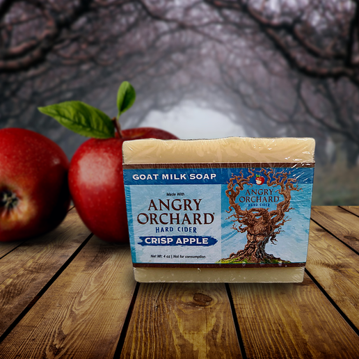 This image shows the bar of soap and the front label. There is imagery of the Angry Orchard tree trunk with a face on it and the logo.