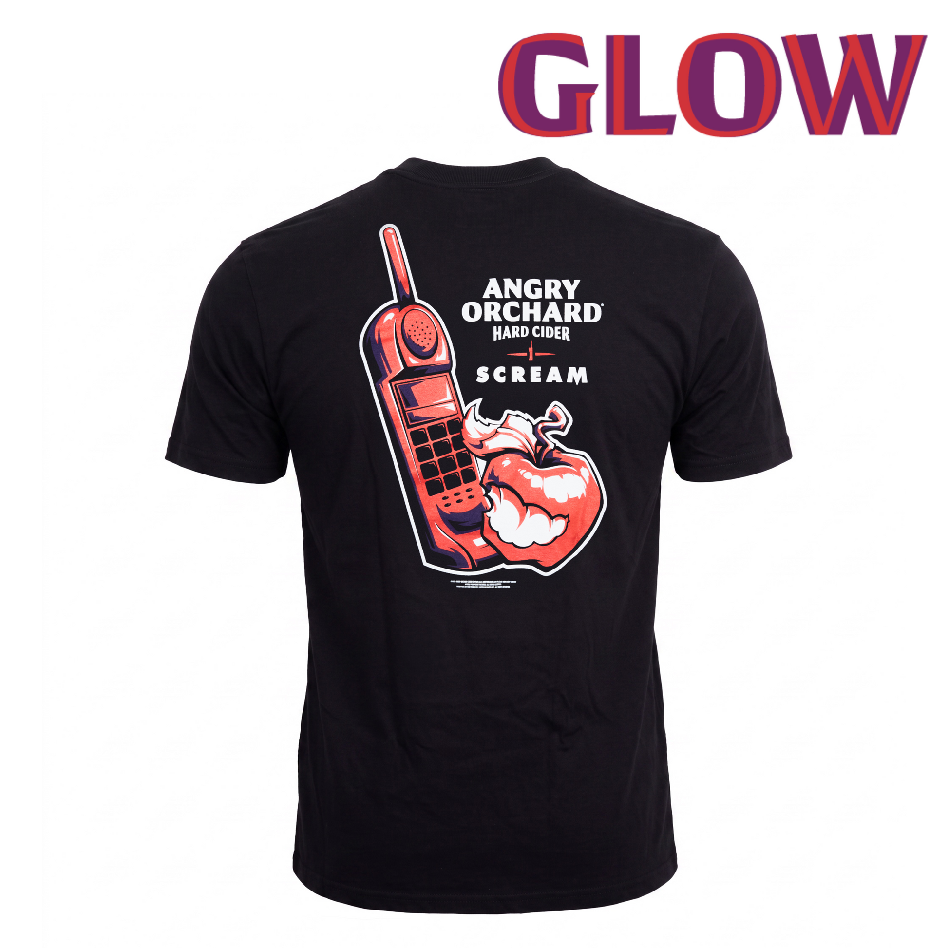A black short-sleeve t-shirt shown from the back, featuring a large graphic print of a red mobile phone, a red apple with a horn, and white text reading 'ANGRY ORCHARD HARD CIDERSCREAM'. The word 'GLOW' is written in large red and purple letters at the top of the image.